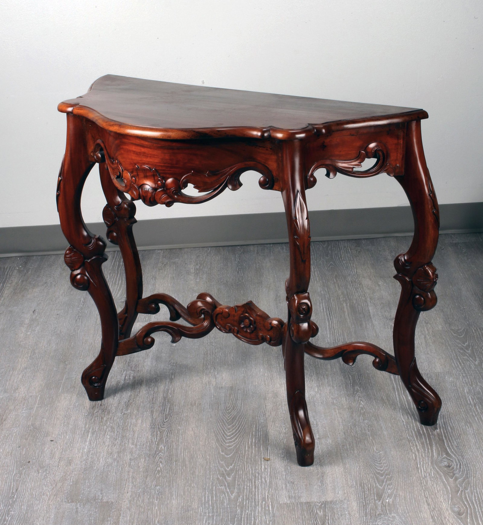 CARVED CONSOLE TABLE: CARVED CONSOLE TABLE Stylized demilune console table with carved apron and legs. 34 3/4" X 15 1/2" X 28 1/2" Shipping:<