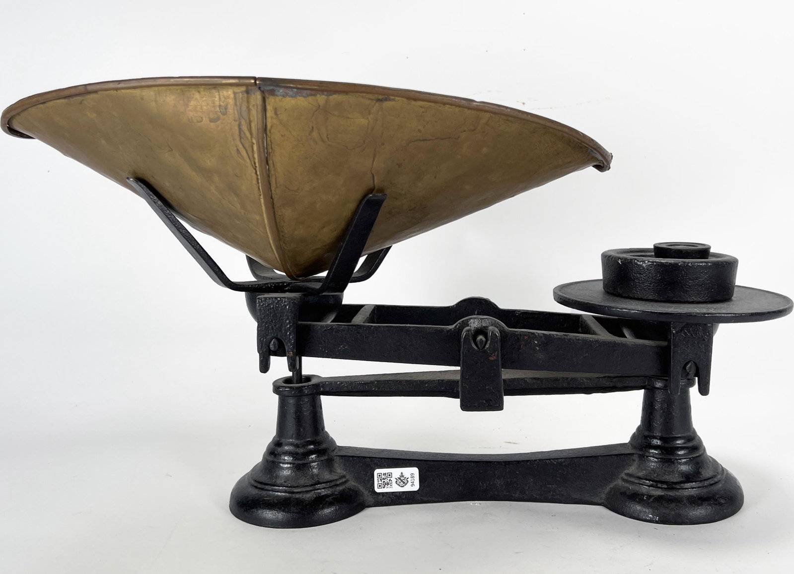 ANTIQUE CAST IRON COUNTER BALANCE SCALE: ANTIQUE CAST IRON COUNTER BALANCE SCALE Cast iron frame with scoop and two weights. 19" X 10" Shipping: