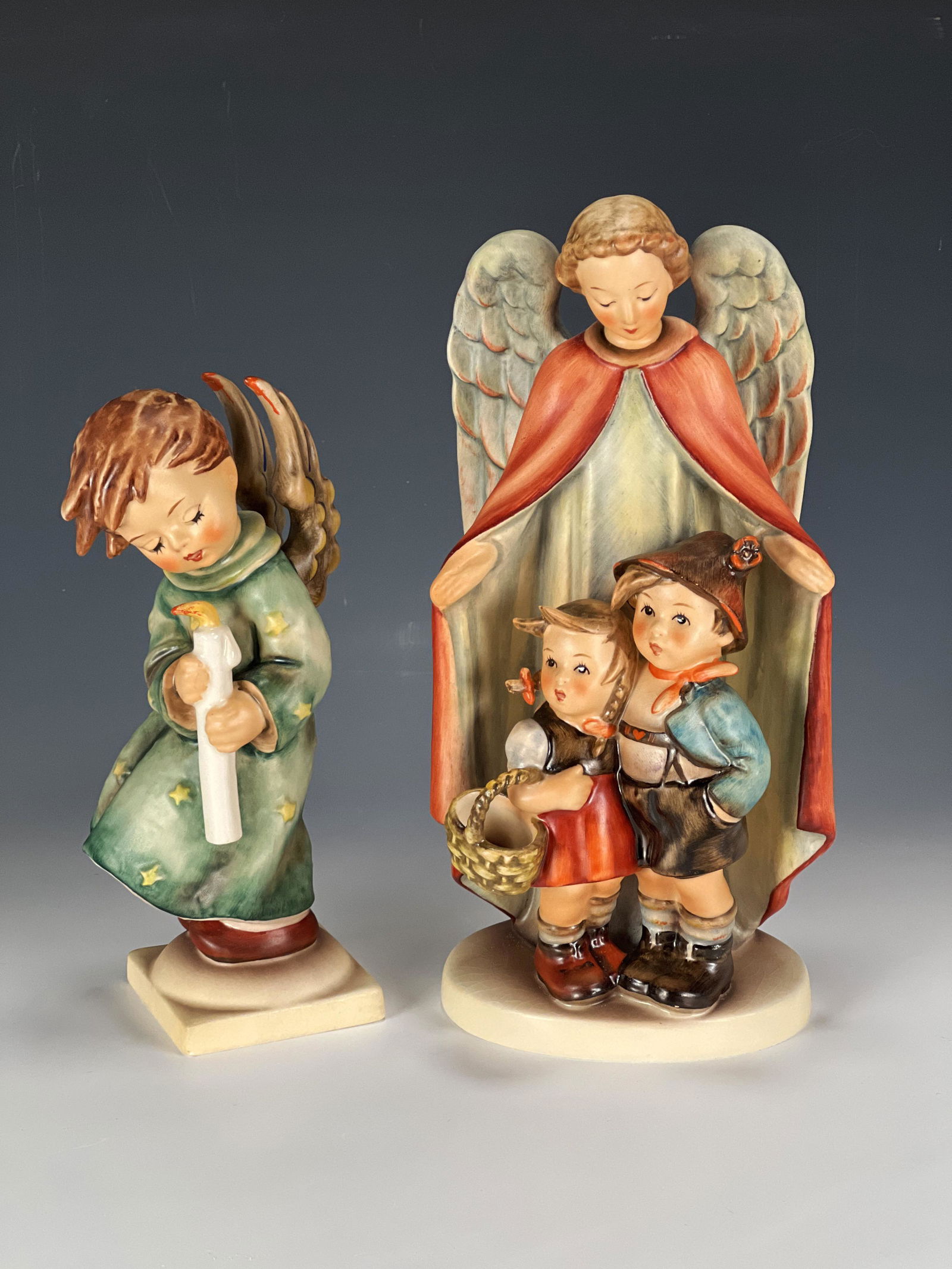 TWO GOEBEL HUMMELS HEAVENLY PROTECTION AND ANGEL: TWO GOEBEL HUMMELS HEAVENLY PROTECTION AND ANGEL Includes Heavenly Angel 21/1 TMK-5. Heavenly Protection 88/11 TMK-5. 7 1/2" X 9 1/2"