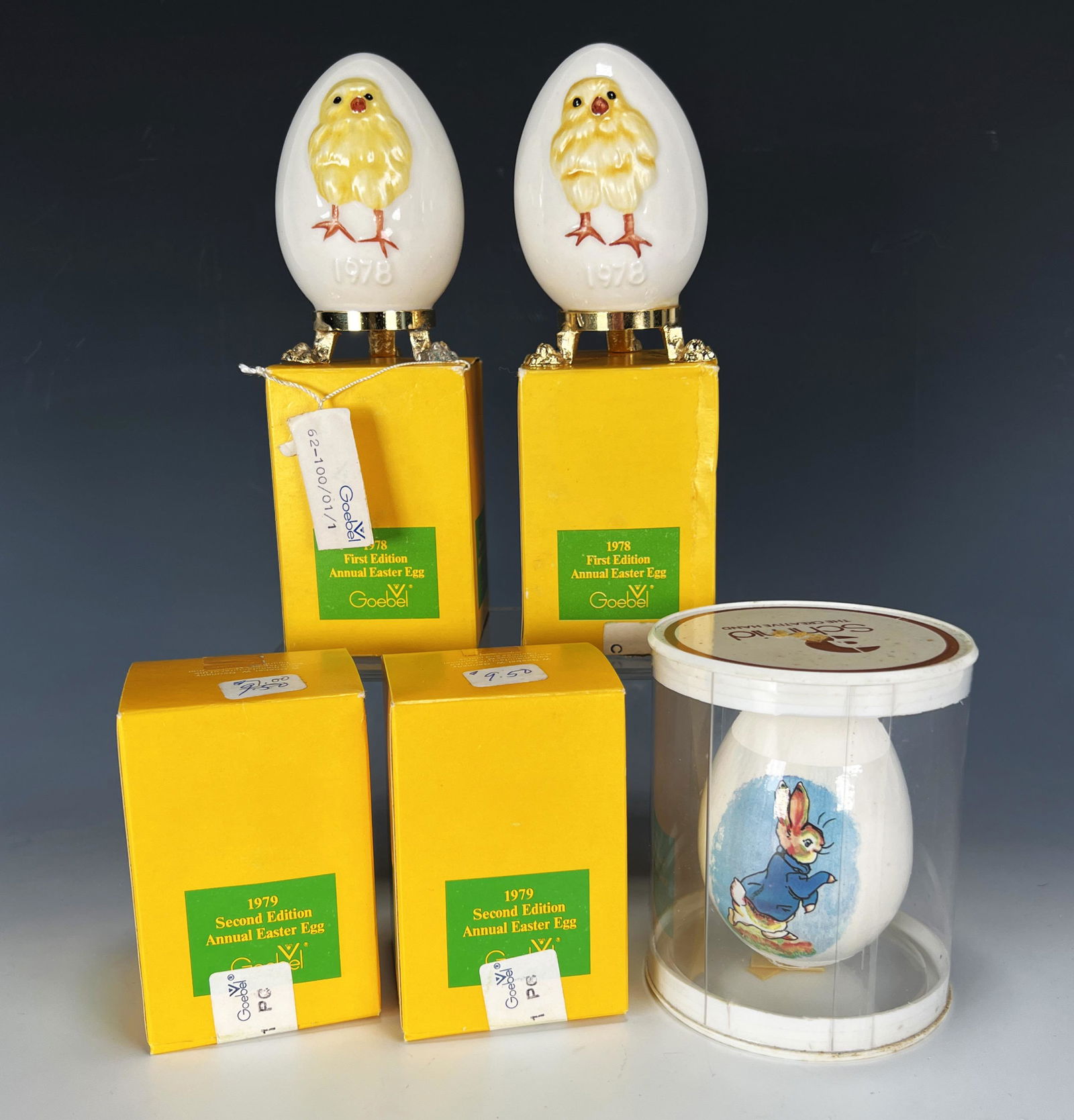 FOUR GOEBEL ANNUAL EASTER EGG ORNAMENTS IN BOX: FOUR GOEBEL ANNUAL EASTER EGG ORNAMENTS IN BOX Two 1978, two 1979 Goebel Annual Easter Egg ornaments in boxes. 1979 boxes are sealed. Including Schmid 1979 limited edition Peter Rabbit e