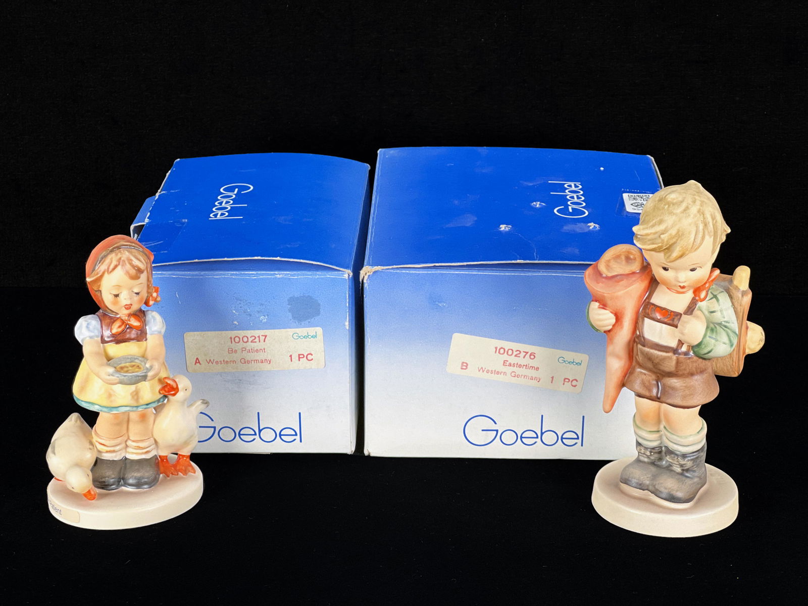 TWO GOEBEL HUMMELS IN BOX: TWO GOEBEL HUMMELS IN BOX Be Patient, TMK-6. Little Scholar TMK-6. 6 3/4" X 5 1/2" X 3 1/2" Shipping: