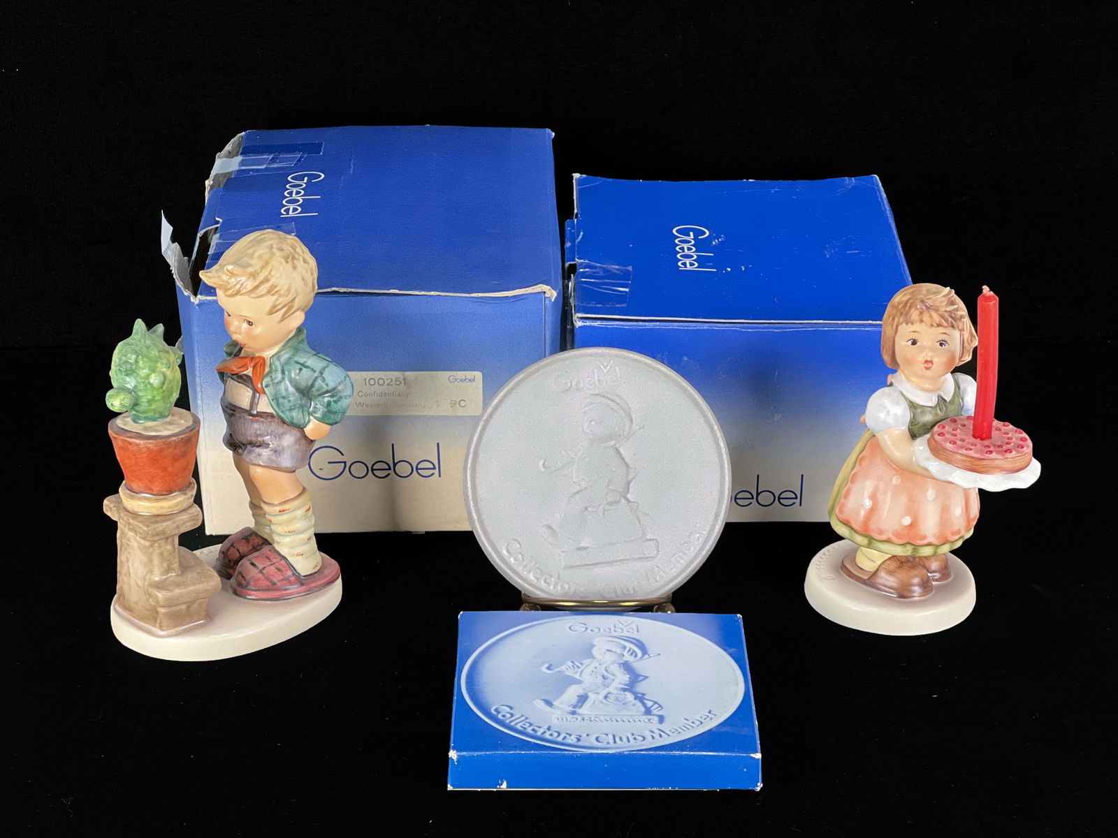 THREE GOEBEL HUMMEL COLLECTORS IN BOX: THREE GOEBEL HUMMEL COLLECTORS IN BOX Boxes have wear. 7 3/4' X 6 1/2" X 4" Shipping: Shipping an