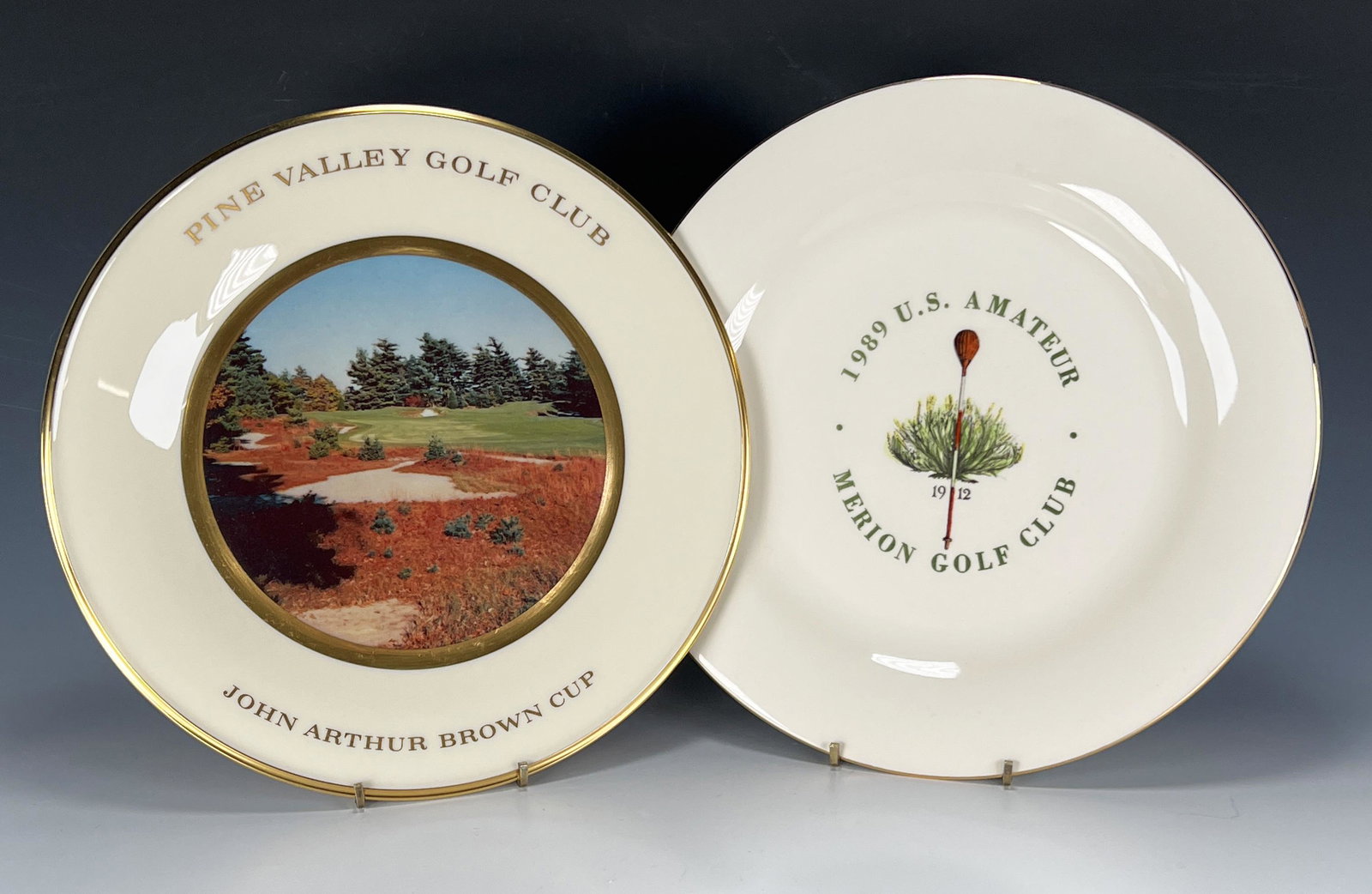 TWO COMMEMORATIVE GOLF PLATES MERION: TWO COMMEMORATIVE GOLF PLATES MERION Pine Valley Golf Club John Arthur Brown Cup. 1989 US Amateur Merion Golf Club. Both marked on back. 10 3/4"
