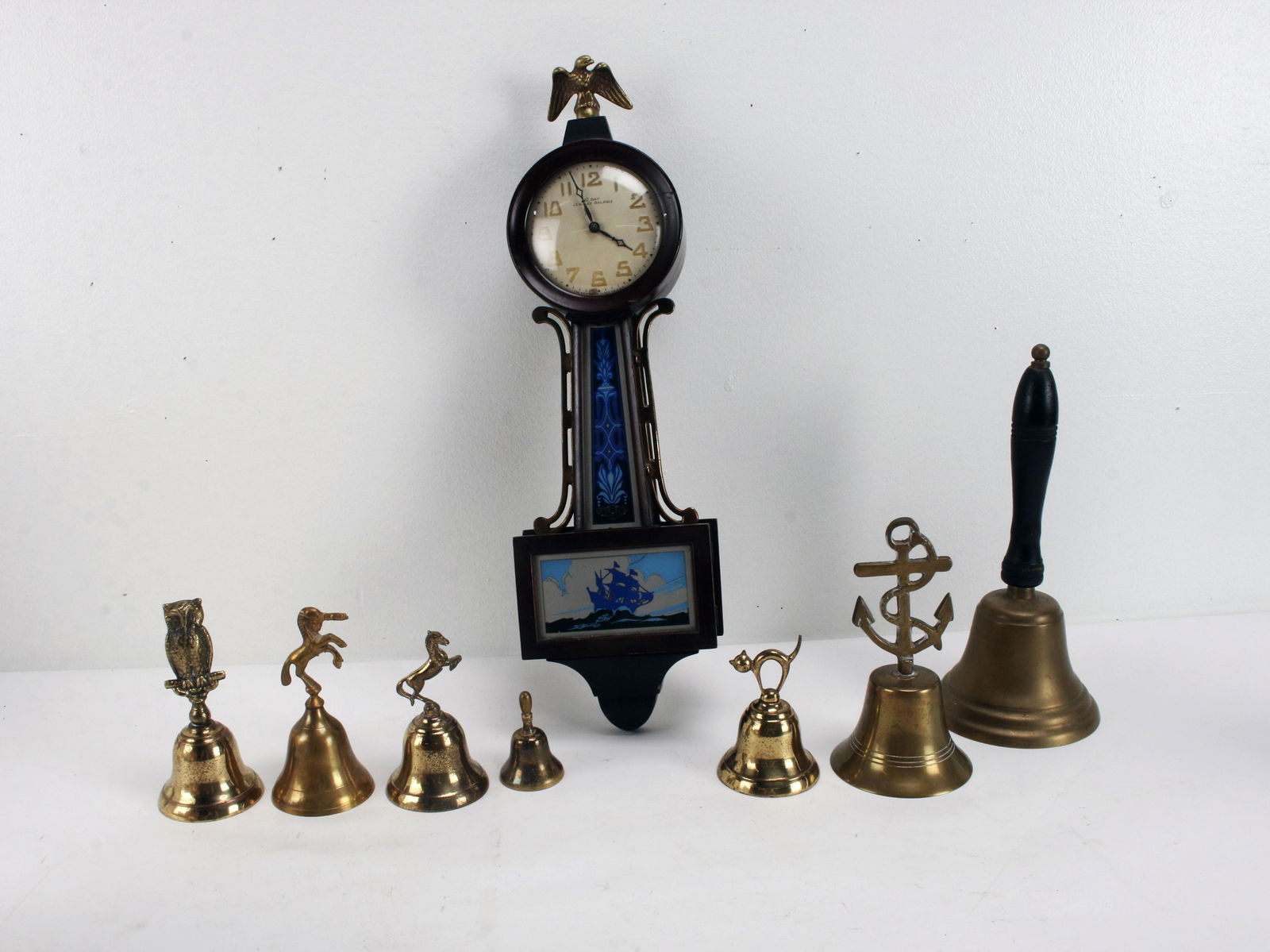 SMALL BANJO CLOCK & COLLECTION OF BRASS BELLS (1 of 6)