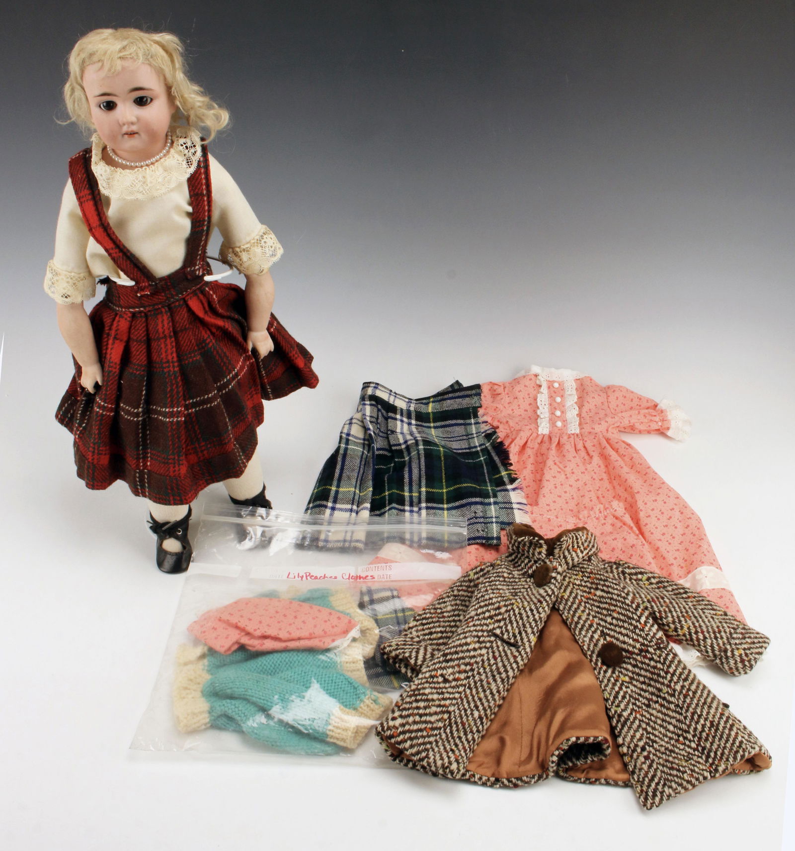 PORCELAIN BISQUE DOLL WITH CLOTHES (1 of 3)