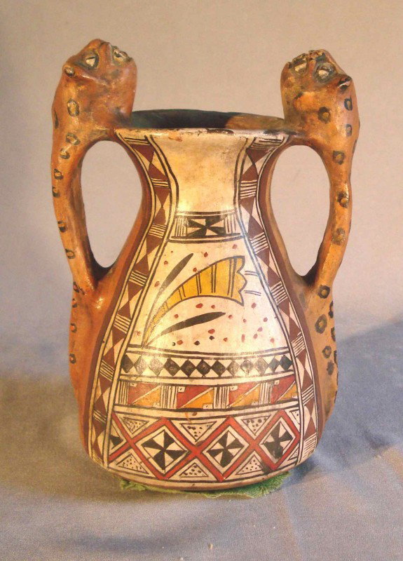Mayan or Inca painted terra cotta vase: A 7 1/2" tall vase with multi-colored decorations and handles in the form of leopards. Believed to be of South American origin.