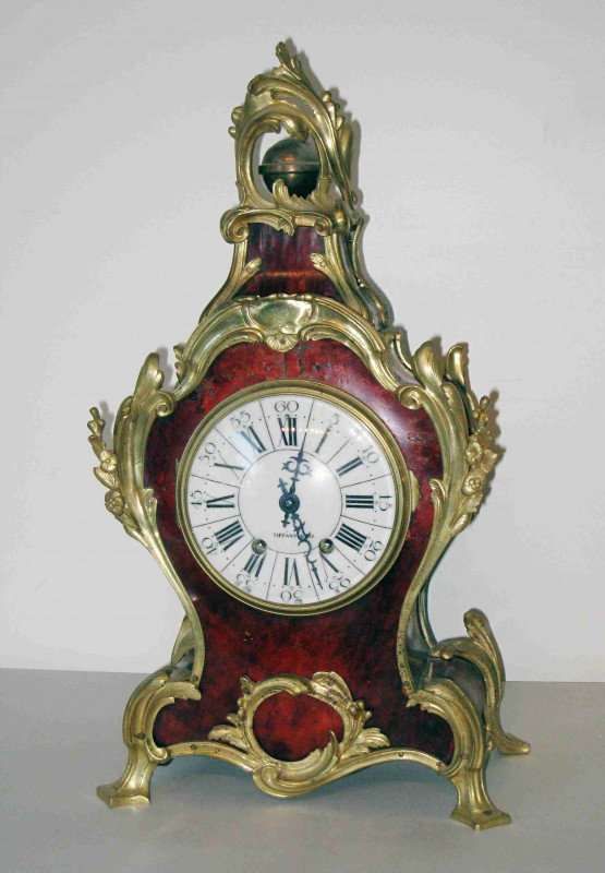 Fine Tiffany mantel clock: This in the style of Louis XV with a faux tortoise and and sumptuous ormolu castings in the Baroque style. The clockworks are stamped "TIffany & Co." and the clock appears to be 19th century.