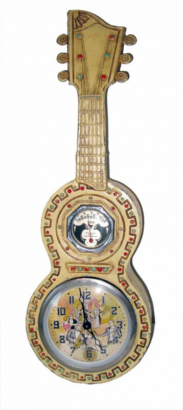 Novel Guitar clock: An automaton clock and thermometer mounted in a metal cold painted guitar. The clock has a automated band conductor who waves his baton as the clock ticks. By the United Clock Co. of Brooklyn, NY.
