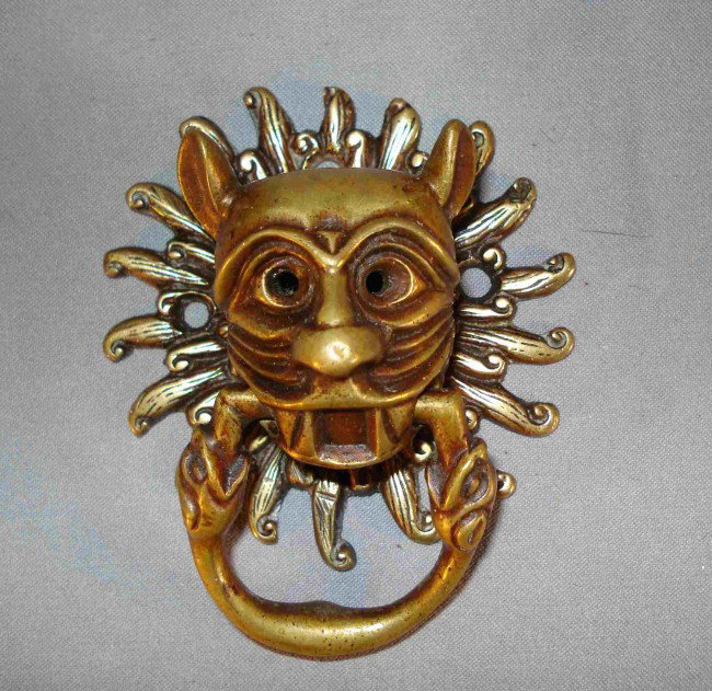 Sun Leopard: Brass knocker