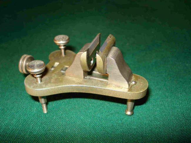 Boley Watchmaker's Poising tool: A tool used to poise, or balance, a round gear or arbor mounted balance wheel from a watch. Jeweled paws, foot levelers and within a fitted box marked "Boley".