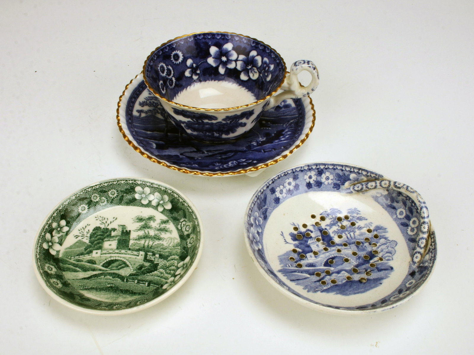 FOUR PIECES COPELAND CHINA ENGLAND: FOUR PIECES COPELAND CHINA ENGLAND Butter pat, teacup and saucer, and small pierced berry insert. 4 1/2" Shipping: