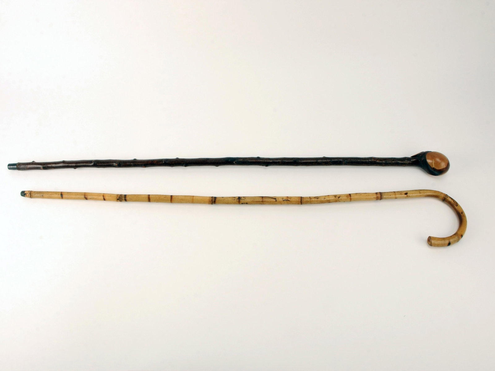 WOODEN CANE & SHILLELAGH CLUB WALKING STICK: WOODEN CANE & SHILLELAGH CLUB WALKING STICK Wooden cane resembling bamboo. Shillelagh club walking stick with knots on shaft. 35"
