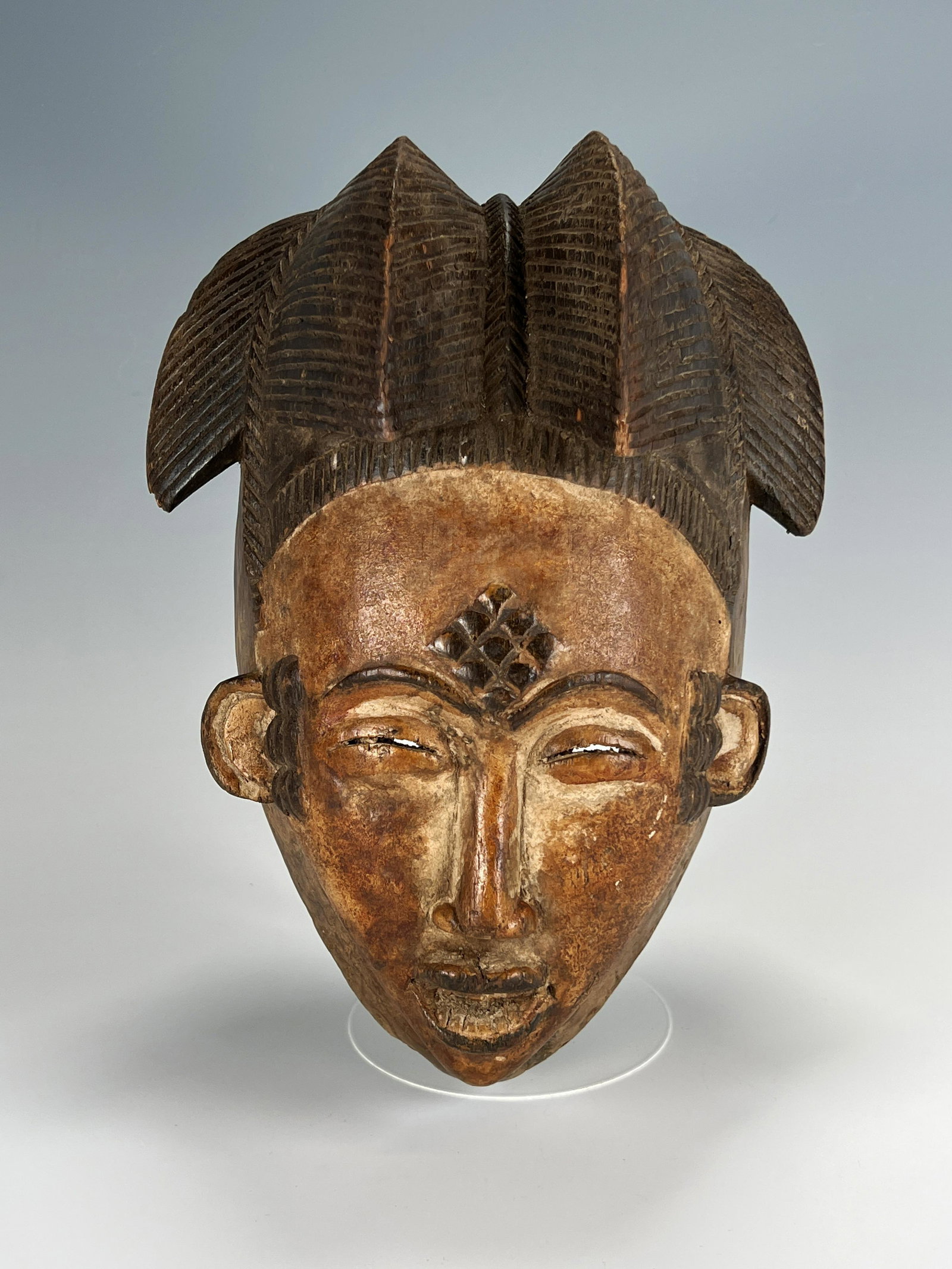 BROWN PATINA MASK PUNU CENTRAL AFRICA: BROWN PATINA MASK PUNU CENTRAL AFRICA 11 1/2" x 8 1/2" x 5 3/4" Shipping: Shipping and handling in the continental US will
