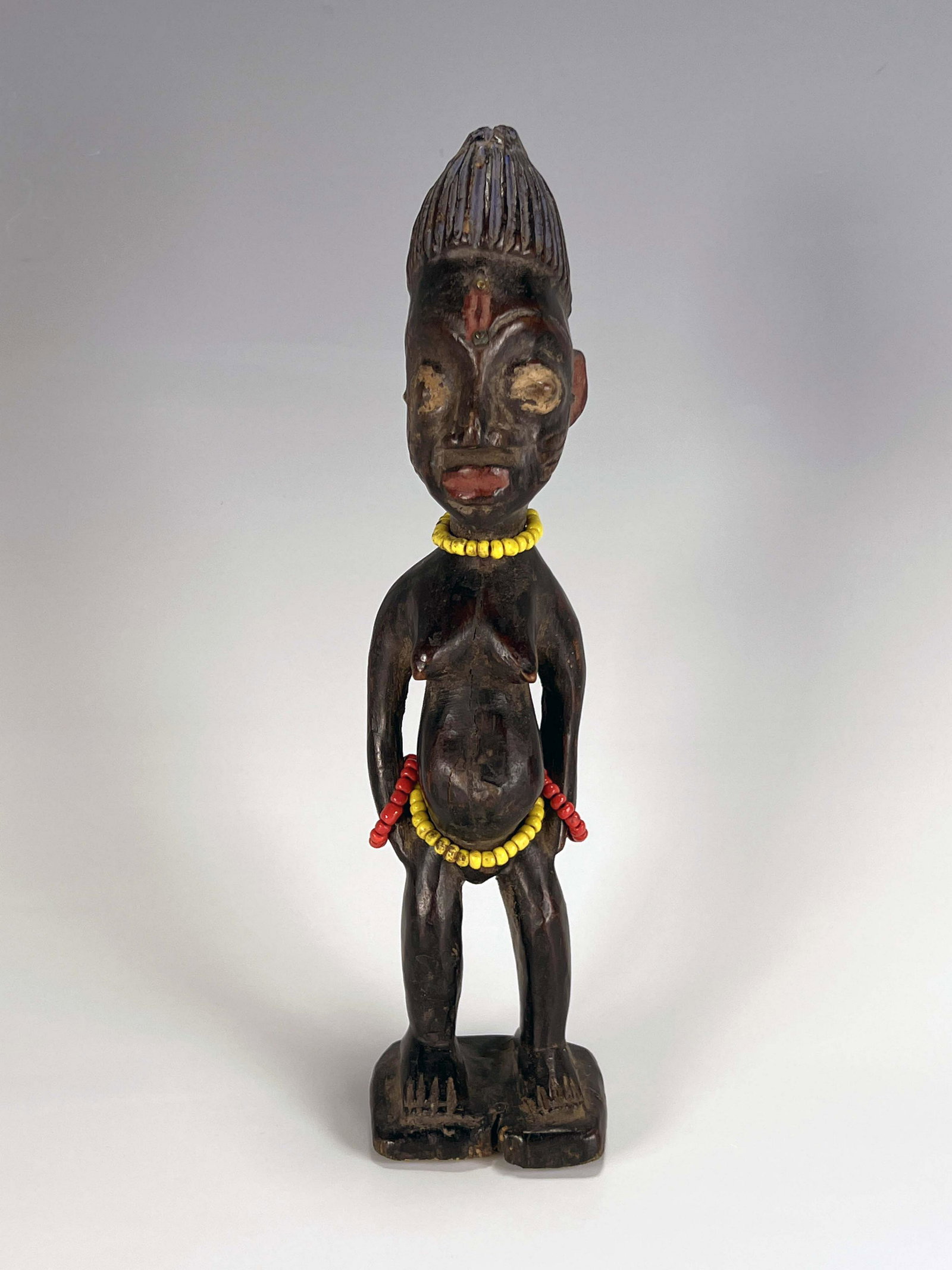YORUBA IBEJI FEMALE STATUE: YORUBA IBEJI FEMALE STATUE 9 3/4" x 2 1/2" x 2 3/4" Shipping: Shipping and handling in the continental US will cost $20.89