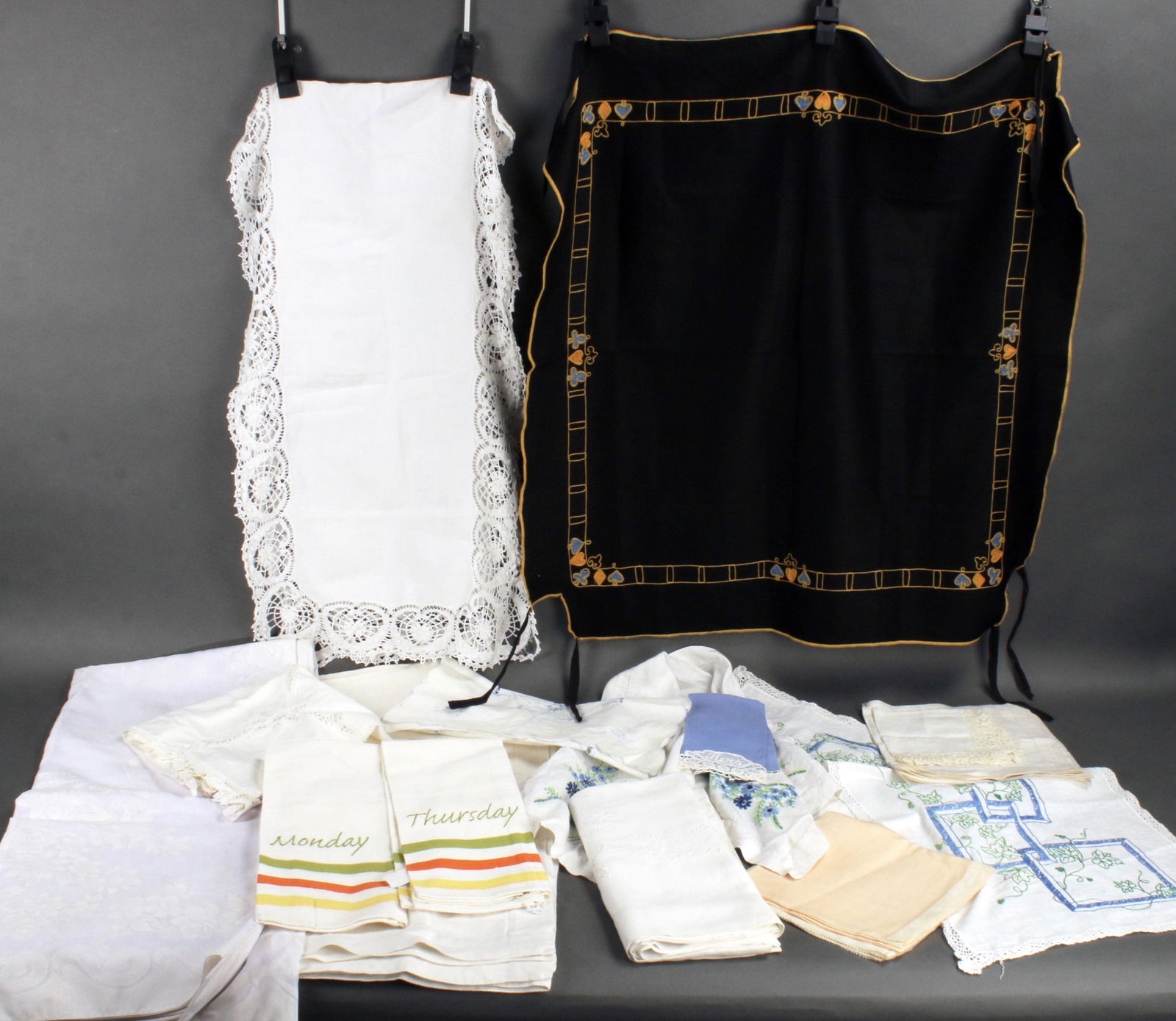 LARGE LOT VINTAGE TABLECLOTHS, NAPKINS, LINENS: LARGE LOT VINTAGE TABLECLOTHS, NAPKINS, LINENS Card table covers including one that is bridge themed, large sheer extremely pale lavender tablecloth 64" X 100", table runners,