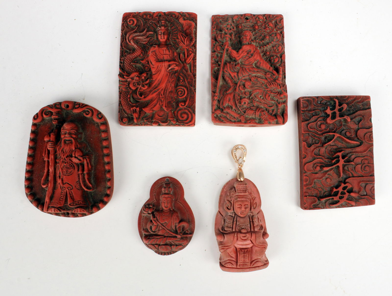 SIX CARVED RED CINNABAR STYLE PENDANTS (1 of 7)