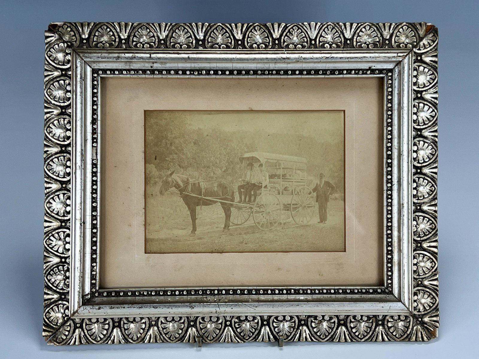 FRAMED VINTAGE PHOTOGRAPH OF VEGETABLE VENDORS: FRAMED VINTAGE PHOTOGRAPH OF VEGETABLE VENDORS Framed picture of three men posing with their horse drawn cart stacked with vegetables. *has fading