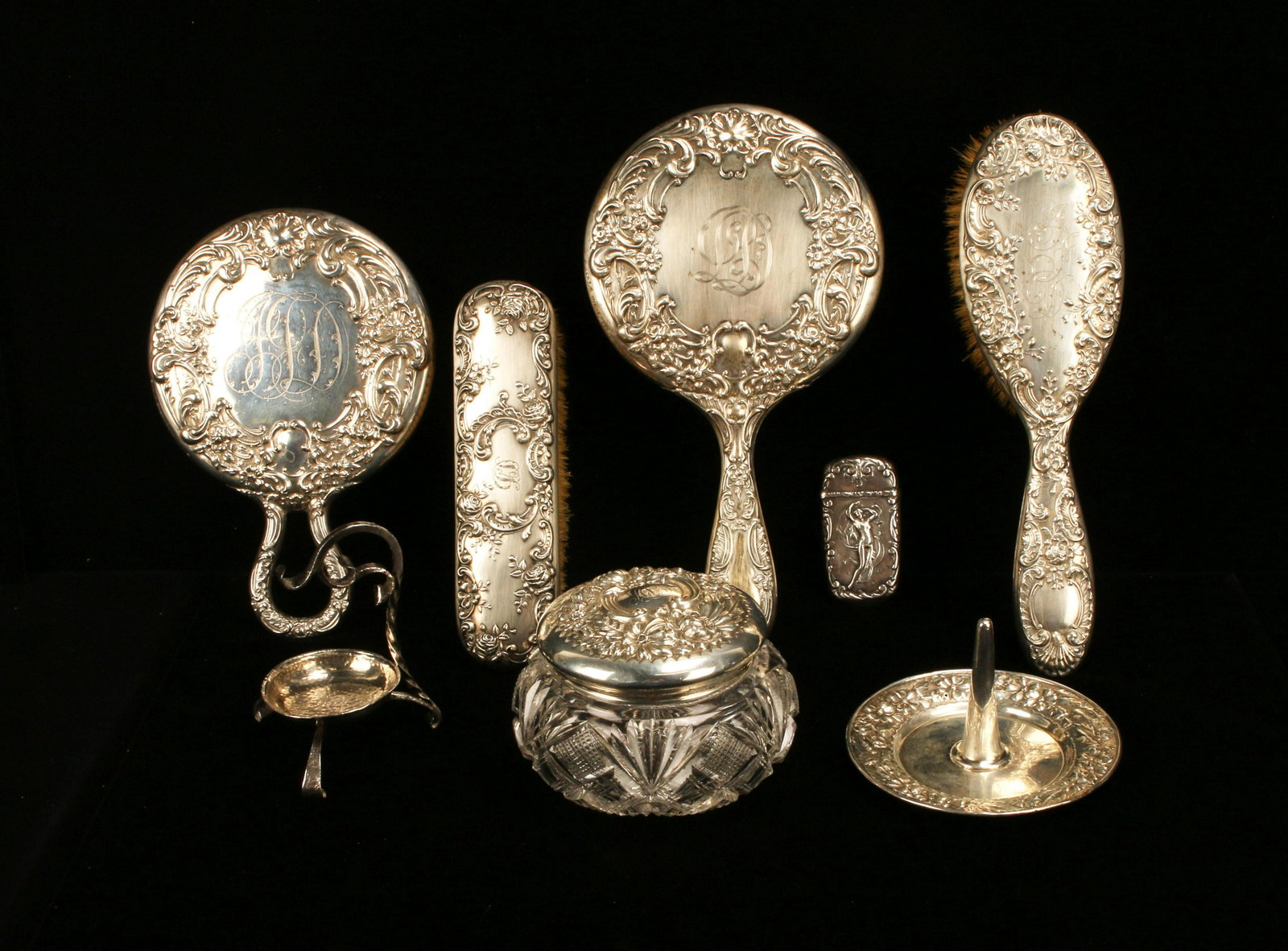 STERLING DRESSER VANITY SET MATCH SAFE: STERLING DRESSER VANITY SET MATCH SAFE Sterling items: Loop hand mirror with hallmark C203. Straight mirror marked C204. Handled brush marked C1252. Clothes brush with no handle marked C