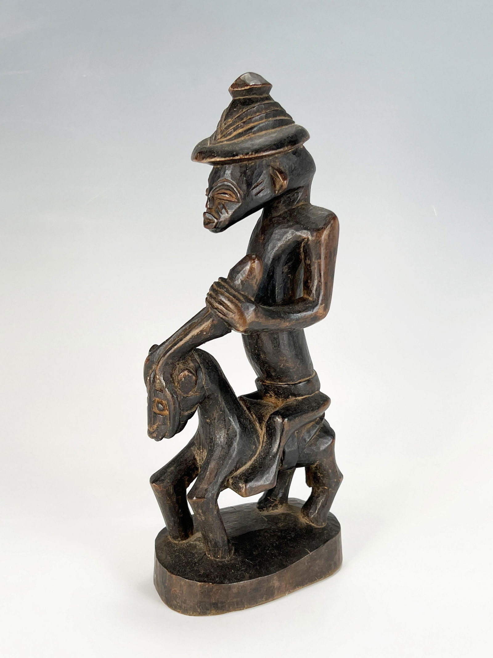 AFRICAN MALE RIDER ON HORSE FIGURE: AFRICAN MALE RIDER ON HORSE FIGURE Carved wooden figure of man riding a horse, possibly from Senufo tribe. *broken hand and ear, see photo. 2 1/2&q