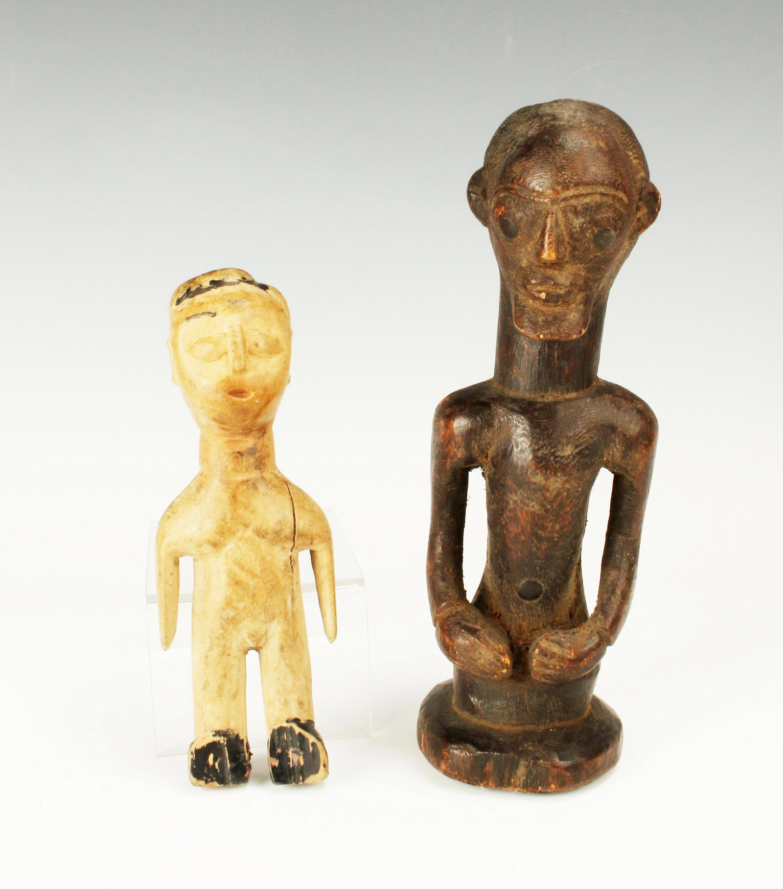TWO AFRICAN CARVED WOODEN STATUES (1 of 7)