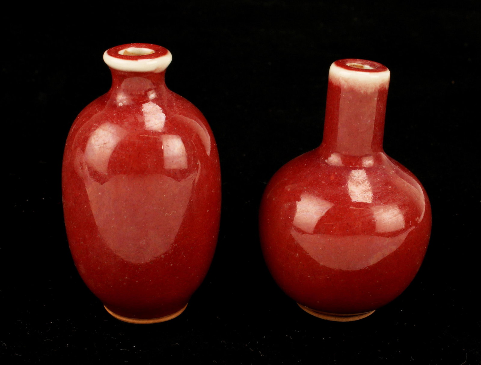 TWO OXBLOOD SNUFF BOTTLES VASES (1 of 3)