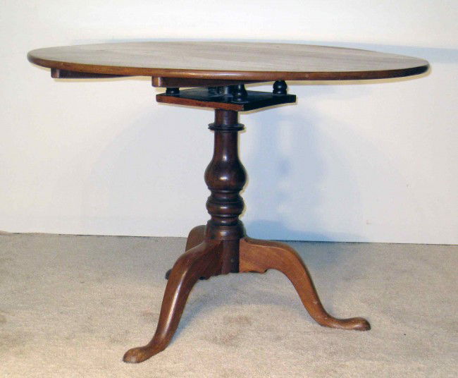 Chippendale Tilt Top Tea Table: A American Chippendale walnut tilt top tea table with a 35" flat round top and snake feet.