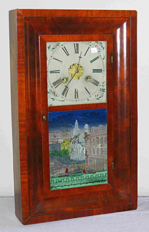 Ogee Clock Of Philadelphia Interest: A mahogany veneer 30 hour ogee clock by New Haven, attributed to Chauncey Jerome and with a label printed by Hiram and a reverse painted glass of Independence Hall.