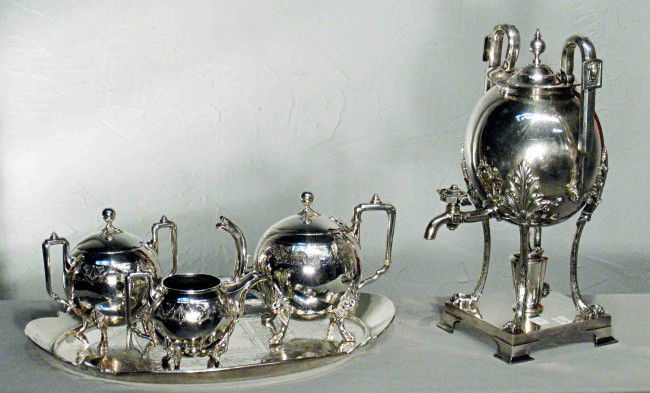 Eastlake Style Coffee Or Tea Set: Reed & Barton silver plate Eastlake style 5 piece tea set, including a tea pot, a 15" coffee urn, creamer, sugar and matching oval shaped Tray.
