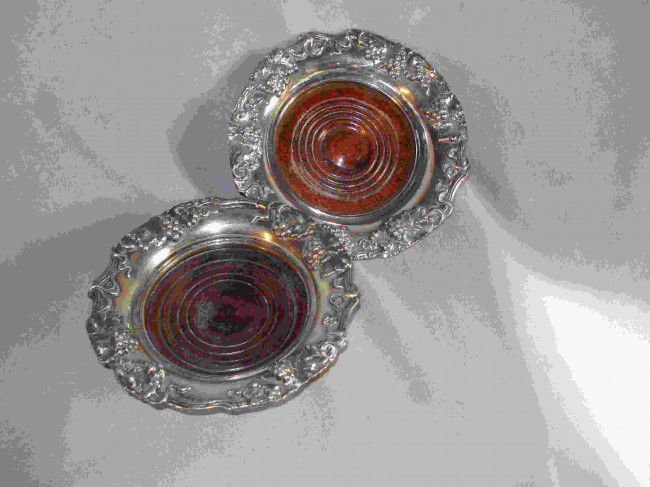 Pair Of Wine Bottle Coasters: Silver plate wine coasters.