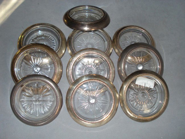 Ten Coasters: Ten associated cut glass and silver bound 4" coasters, nine marked "Sterling"