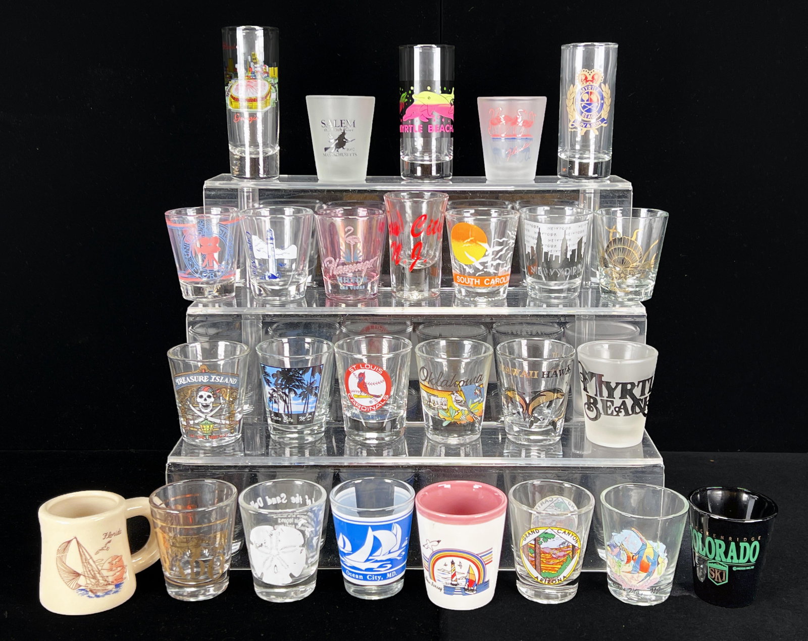 COLLECTION OF US DESTINATION SHOT GLASSES: COLLECTION OF US DESTINATION SHOT GLASSES Glasses from all sorts of US destinations. 4 1/2" x 2" Shipping: