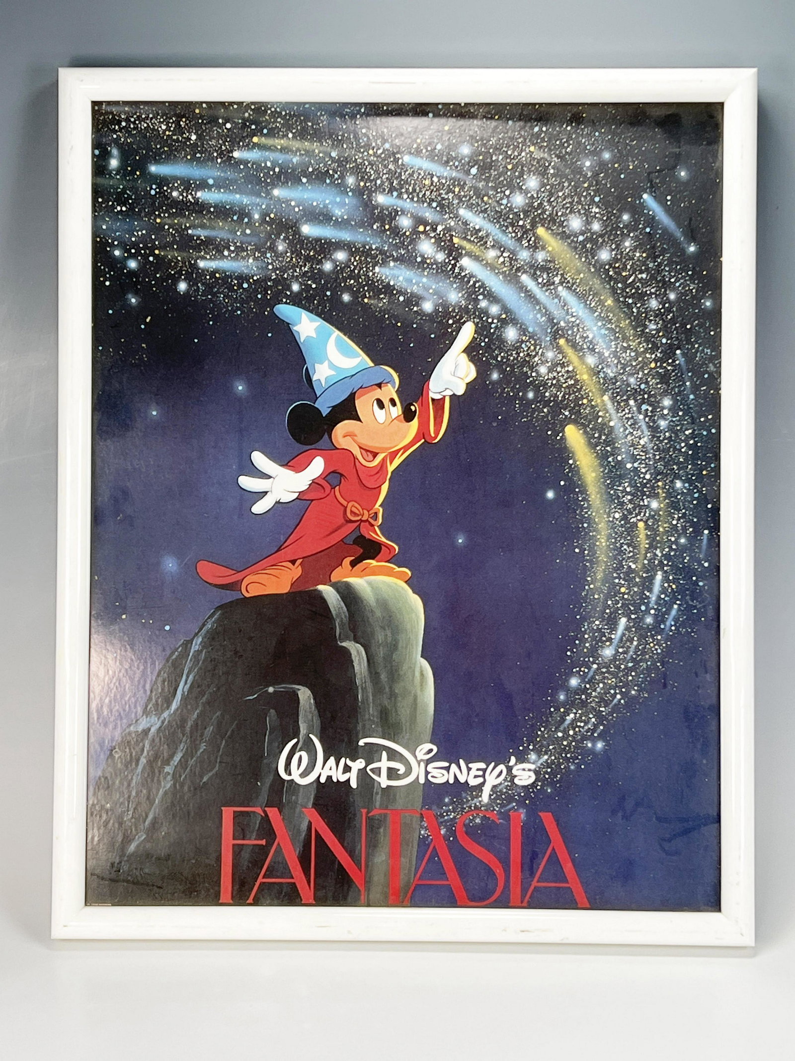 WALT DISNEY FANTASIA MICKEY MOUSE FRAMED POSTER: WALT DISNEY FANTASIA MICKEY MOUSE FRAMED POSTER Famed poster of Mickey Mouse as the Sorcerer's Apprentice in Walt Disney's Fantasia. 16 1/4" X 20"