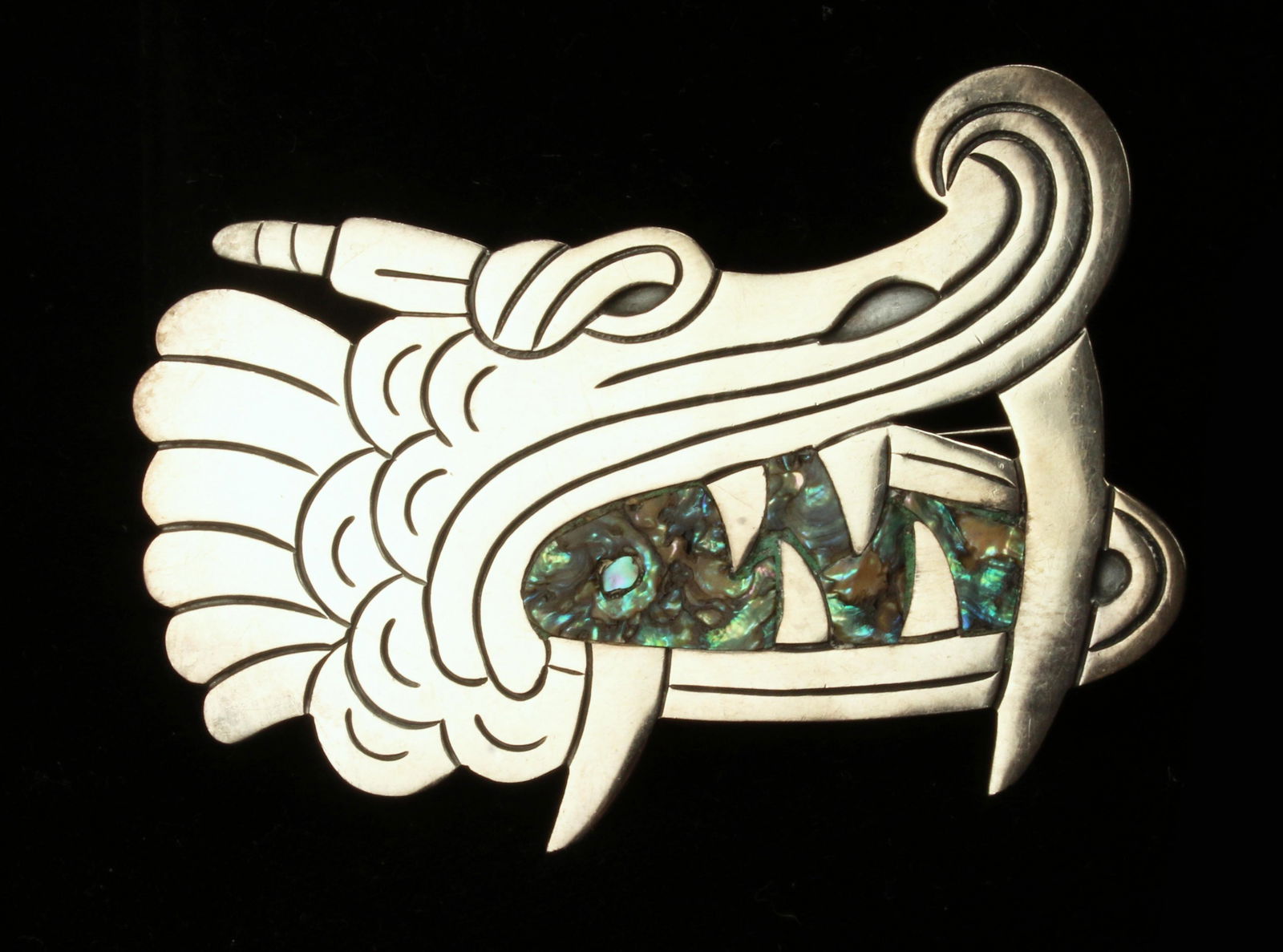 LARGE SIGNED ABALONE STERLING MEXICAN DRAGON PIN: LARGE SIGNED ABALONE STERLING MEXICAN DRAGON PIN Vintage pin, marked CP, Taxco Mexico Sterling 925. Traditional design of a dragon in profile, baring its teeth. Inlaid with abalone. The