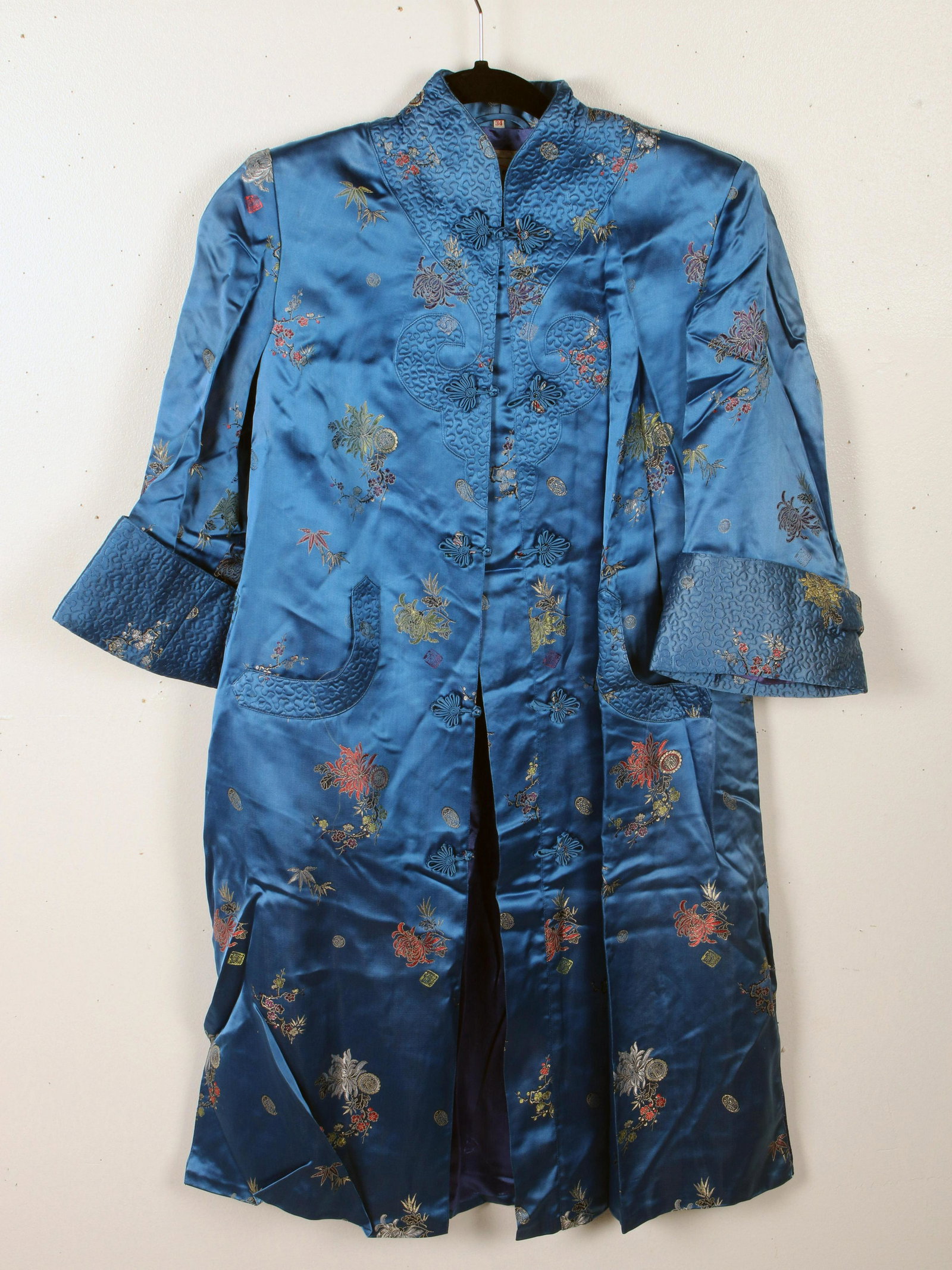 PEONY BRAND SILK SHORT ROBE: PEONY BRAND SILK SHORT ROBE Size 34. Blue silk with embroidered flowers and medallions. Label says Peony Shanghai China. Length: 38" - Shoulder to sh