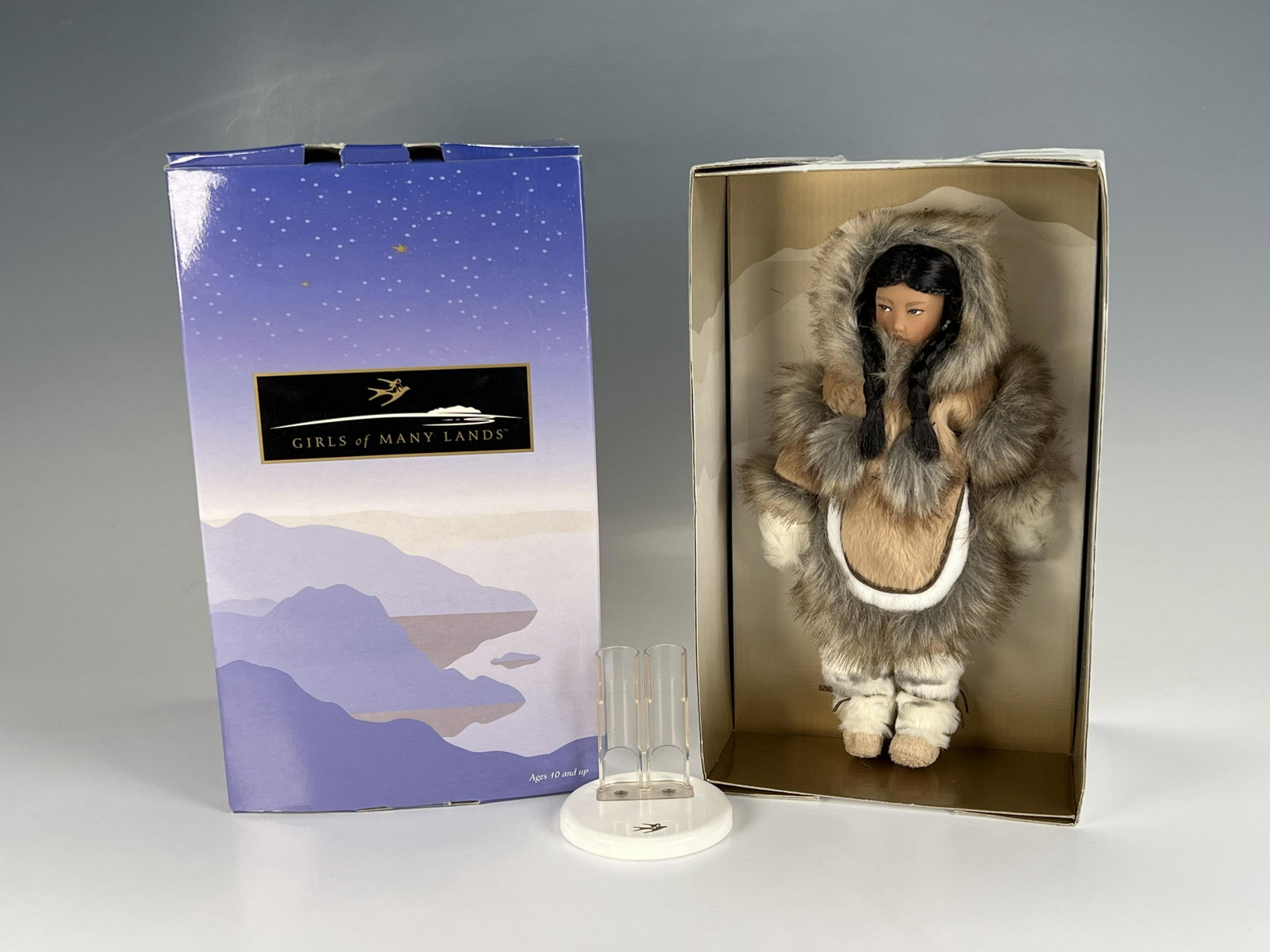 AMERICAN GIRL GIRLS OF MANY LANDS YUPIK IN BOX: AMERICAN GIRL GIRLS OF MANY LANDS YUPIK IN BOX Doll and stand in box. Book not included. Box has wear. 6 3/4" X 11" X 6" <