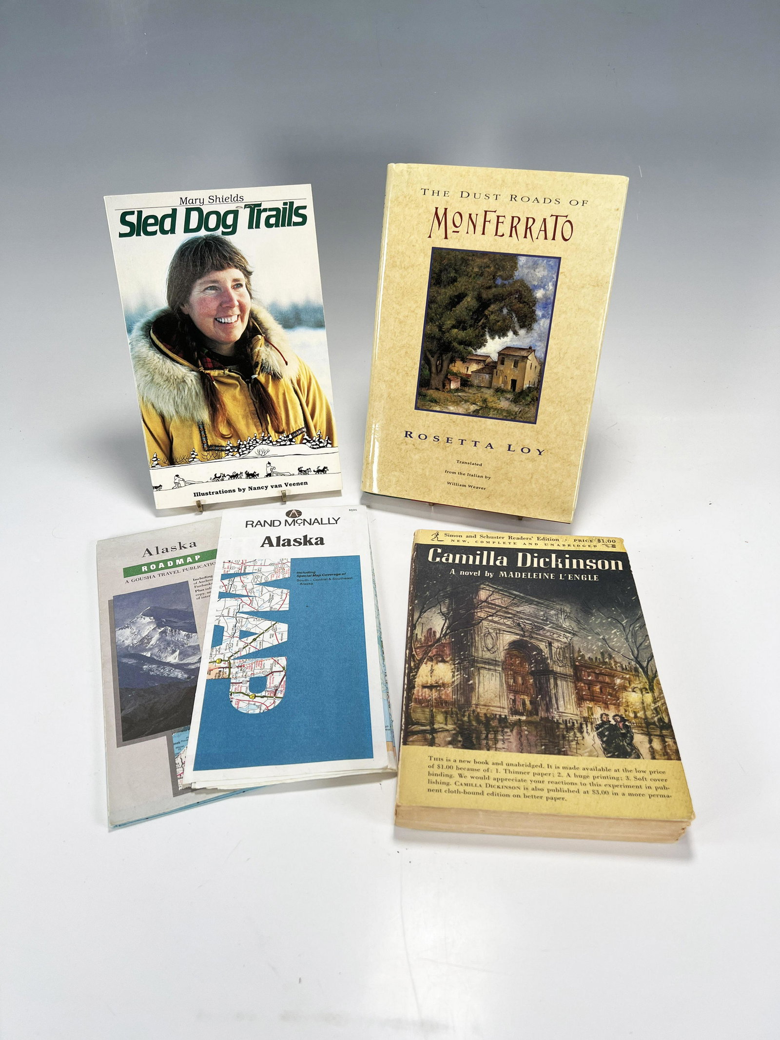 3 BOOKS BASED IN TRAVEL DESTINATIONS TWO SIGNED: 3 BOOKS BASED IN TRAVEL DESTINATIONS TWO SIGNED Camilla Dickinson - by Madeleine L'Engle, first printing, copyright 1951, signed, was made into a movie in 2012. Sled Dog Trails - by Mar