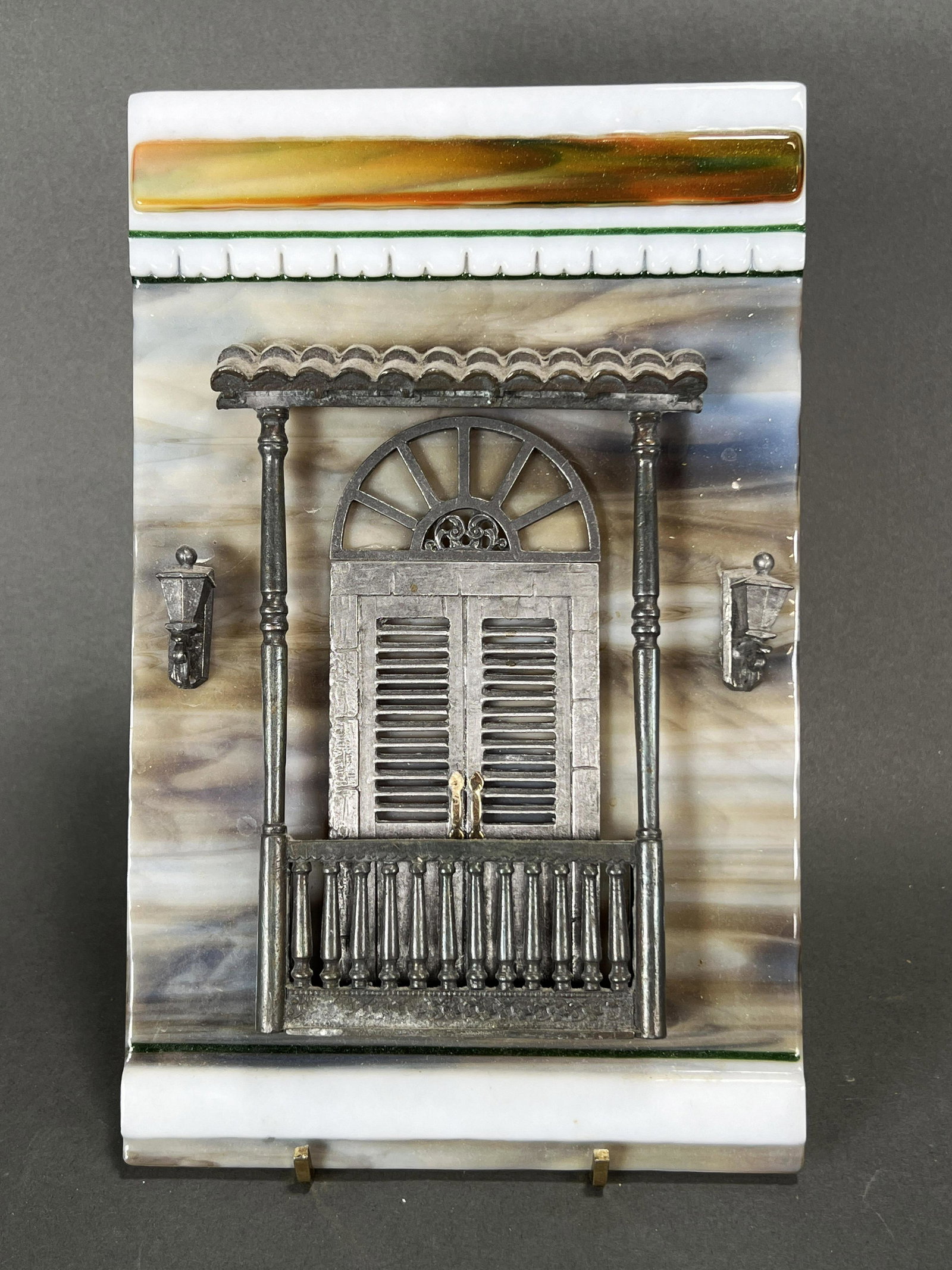 PUERTO RICAN MADE GLASS & METAL TILE OF DOORWAY: PUERTO RICAN MADE GLASS & METAL TILE OF DOORWAY Glass tile with metal doorway and light decoration. Artist information on back. 6" X 9 1/2"</