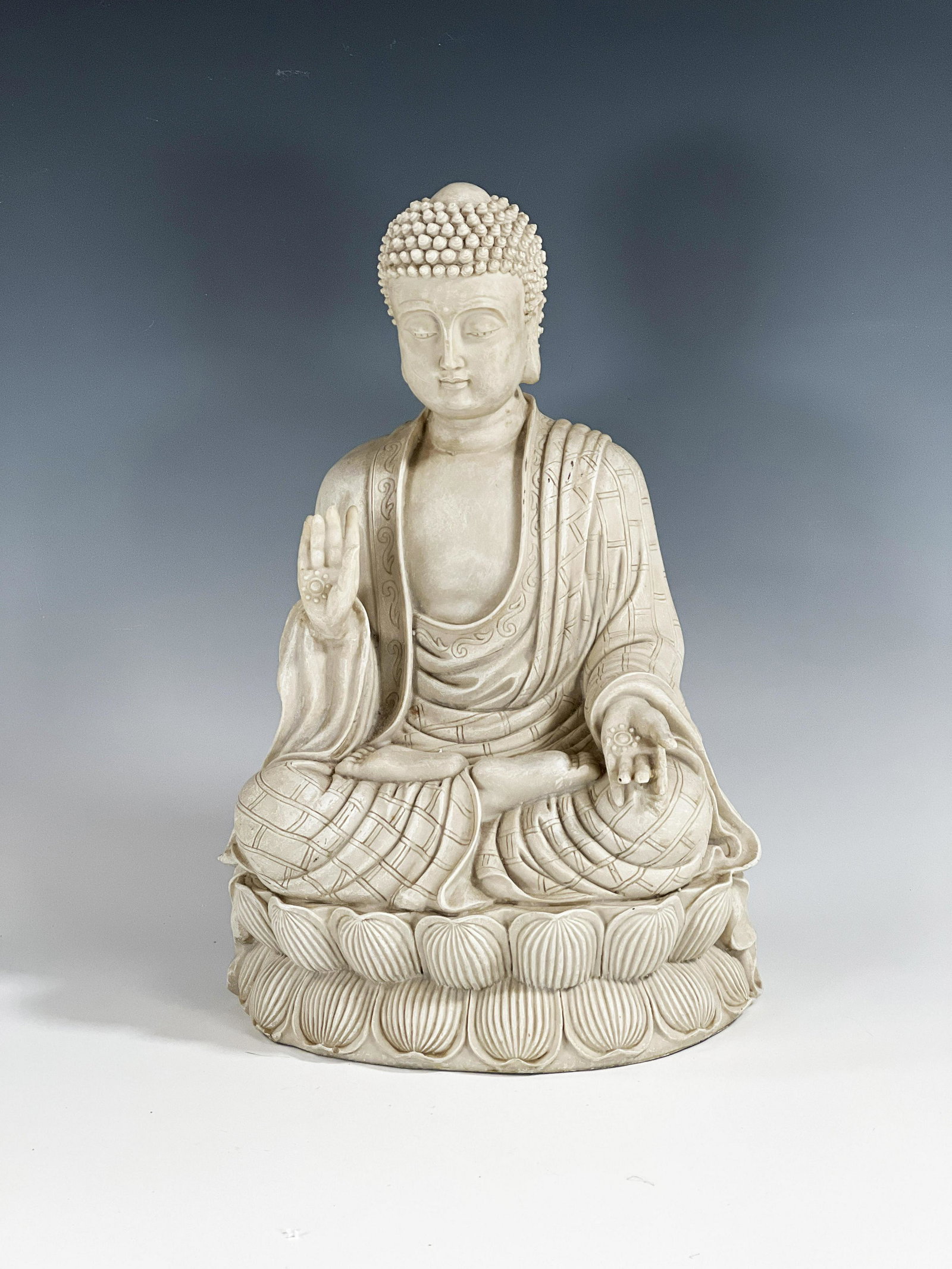 SEATED BUDDHA ON LOTUS STATUE: SEATED BUDDHA ON LOTUS STATUE Statue of meditating Buddha sitting on lotus flower. 12" x 8" x 7" Shipping: