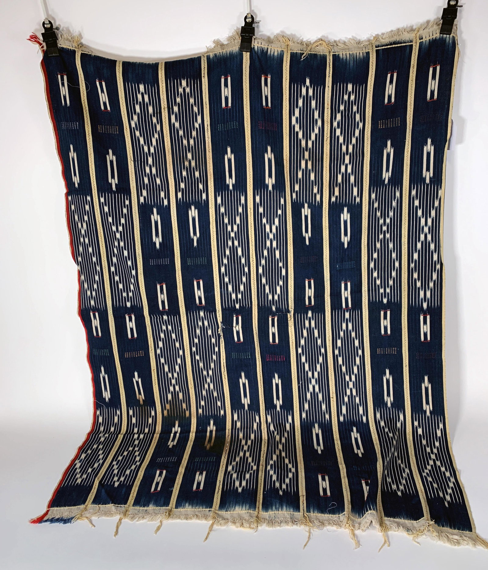 WOVEN BURKINA TEXTILE: WOVEN BURKINA TEXTILE Woven in blues and creams, with fringe. 55" x 40" Shipping: Shipping and h