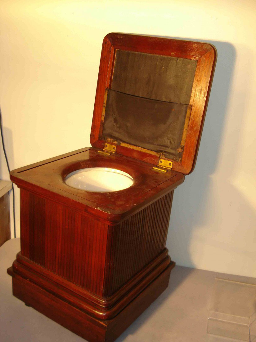 Commode Stool: Possibly Asian, a wooden stool, well made and within is a white porcelain potty.