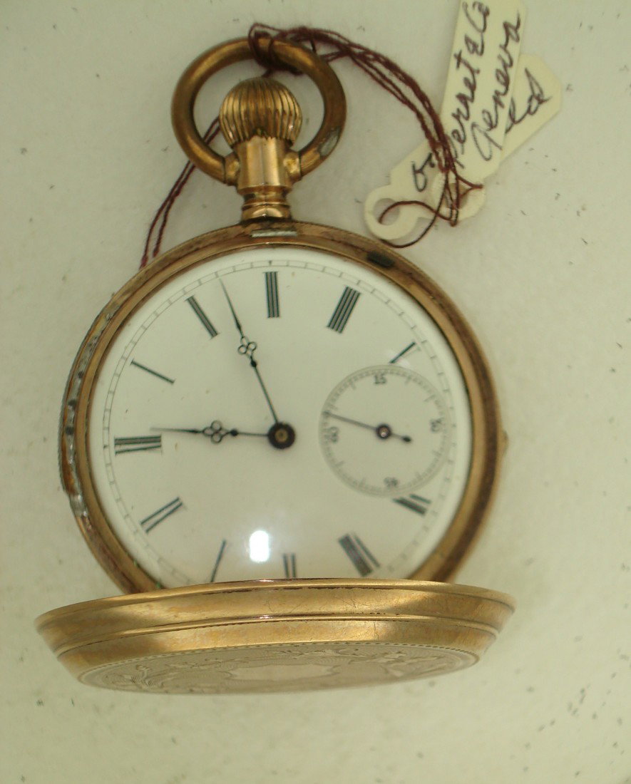 A Swiss Ladies Watch: Appears to be solid gold case, but no markings, on this Swiss hunting cased 15 jewel watch in good condition, by Perret & Co., Geneva. Lever set.