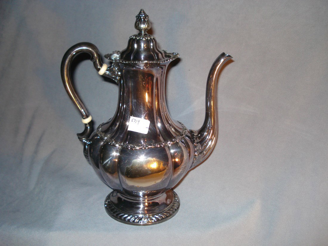 Silver Tea Kettle Stamped "Tiffany & Co.": A 19th century silver plate 10 1/2" tea kettle stamped on the bottom "Tiffany & Co."