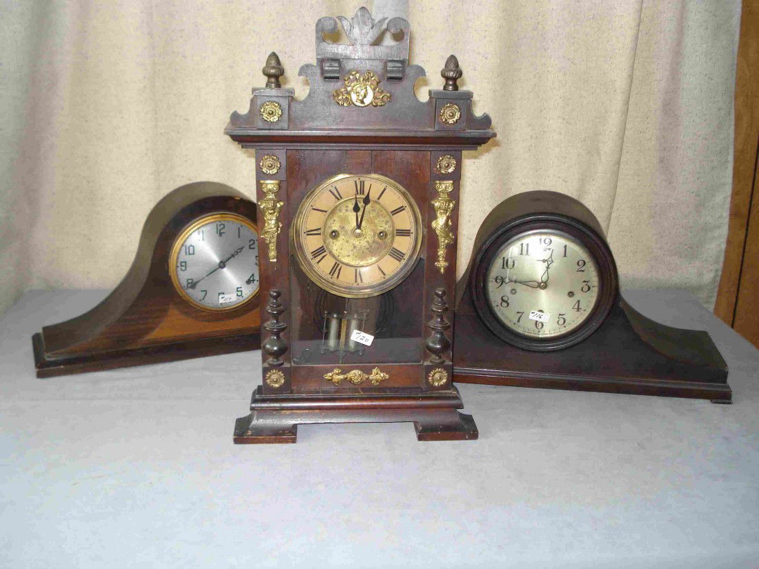 American Mantel Clocks: Two tambour form clocks and one mantel clock, the latter apparently of German origins, ca 1900.