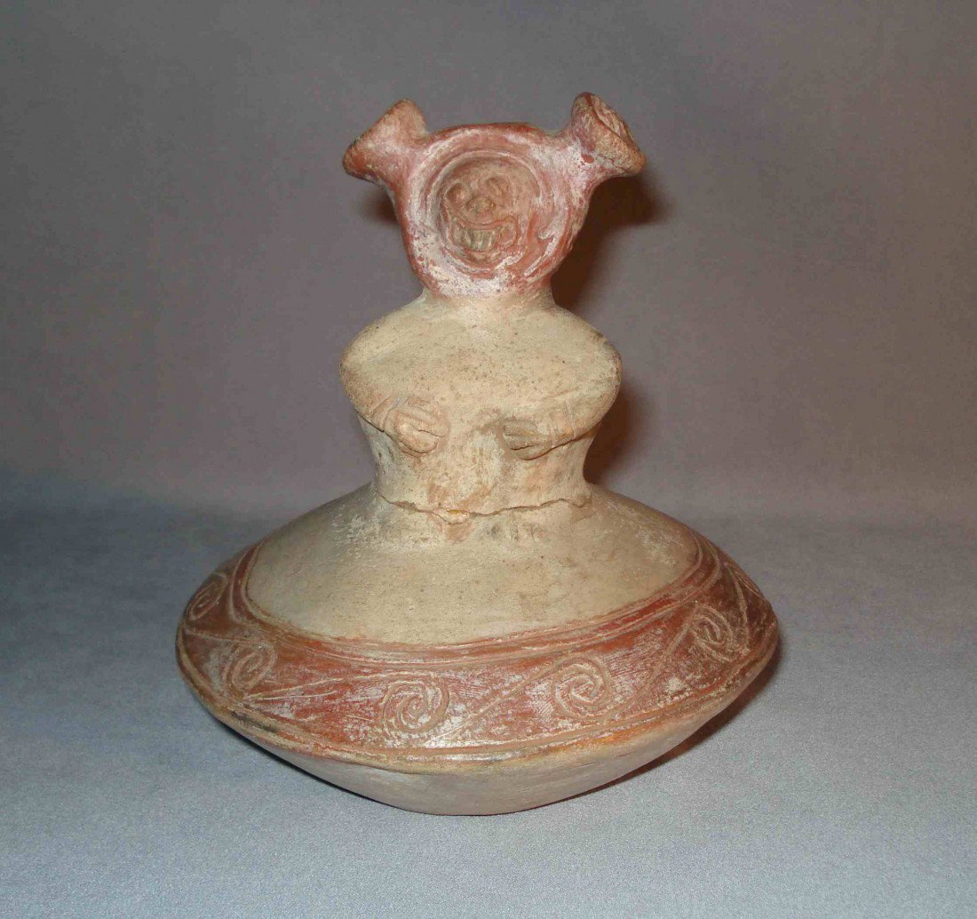 Pre-Colombian Statue: An unusual fantasy like God figure atop a hollow pottery base. (An ancient alien on his flying saucer space ship?) Once painted and with a repair where the top figure broke off from the base. 6 1/2" h