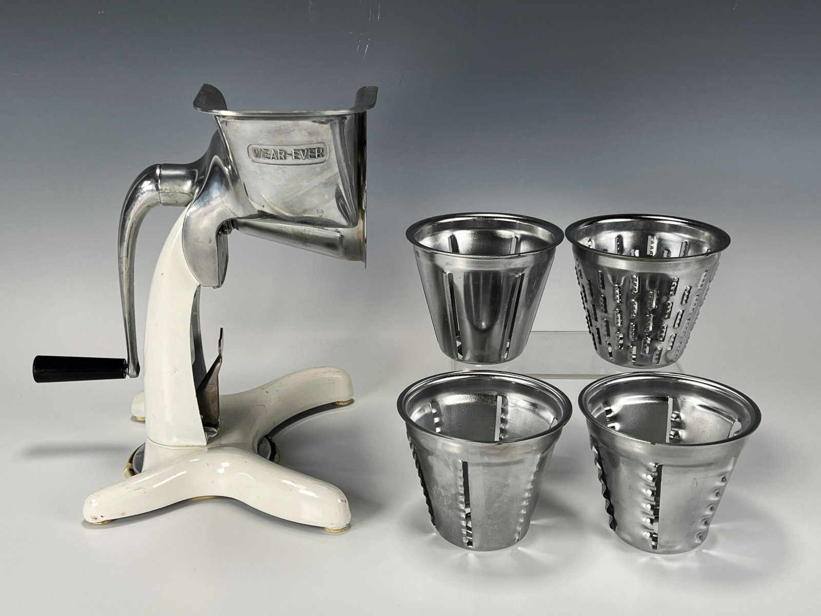 VINTAGE WEAR EVER MANUAL SHREDDER SLICER: VINTAGE WEAR EVER MANUAL SHREDDER SLICER It slices, it dices, not sure about julienne fries though. 8" X 6 1/2" X 10" S