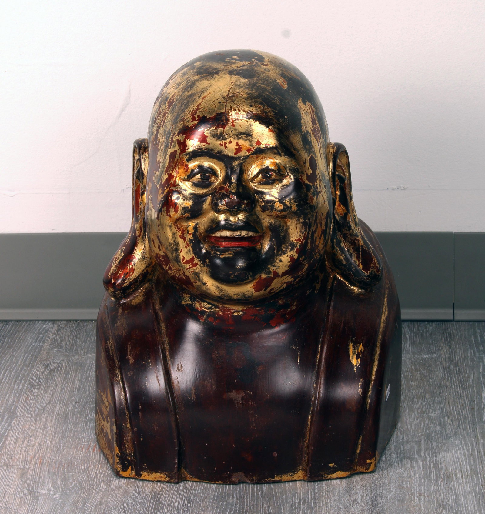 HEAVY STONE HAPPY BUDDHA HEAD: HEAVY STONE HAPPY BUDDHA HEAD With elongated earlobes. Brown and red patinas with gold head. 11" X 10 1/2" X 15 Shipping:
