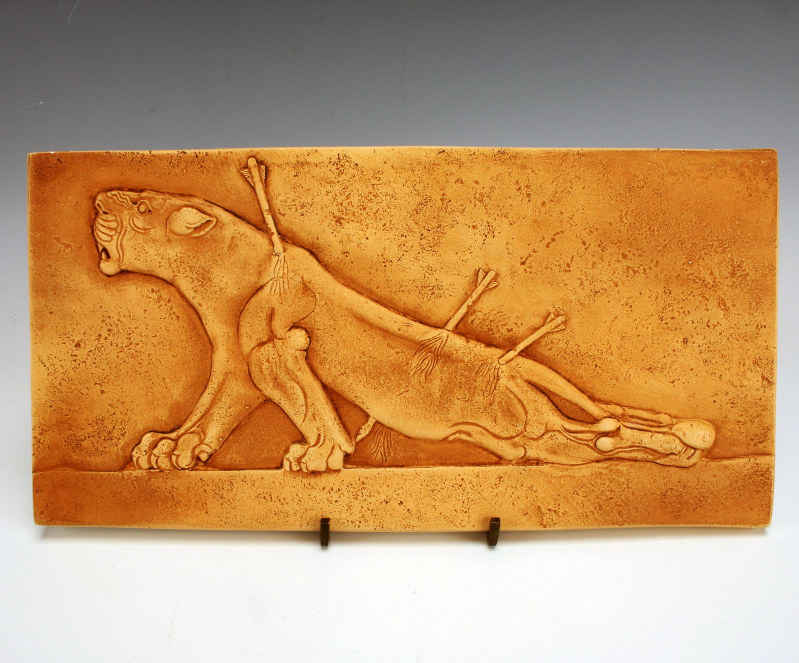 WOUNDED LIONESS TILE SYRIAN BRITISH MUSEUM: WOUNDED LIONESS TILE SYRIAN BRITISH MUSEUM Tile of a dramatically wounded lioness, description on reverse. Reproduction of Syrian tile in the British Museum.