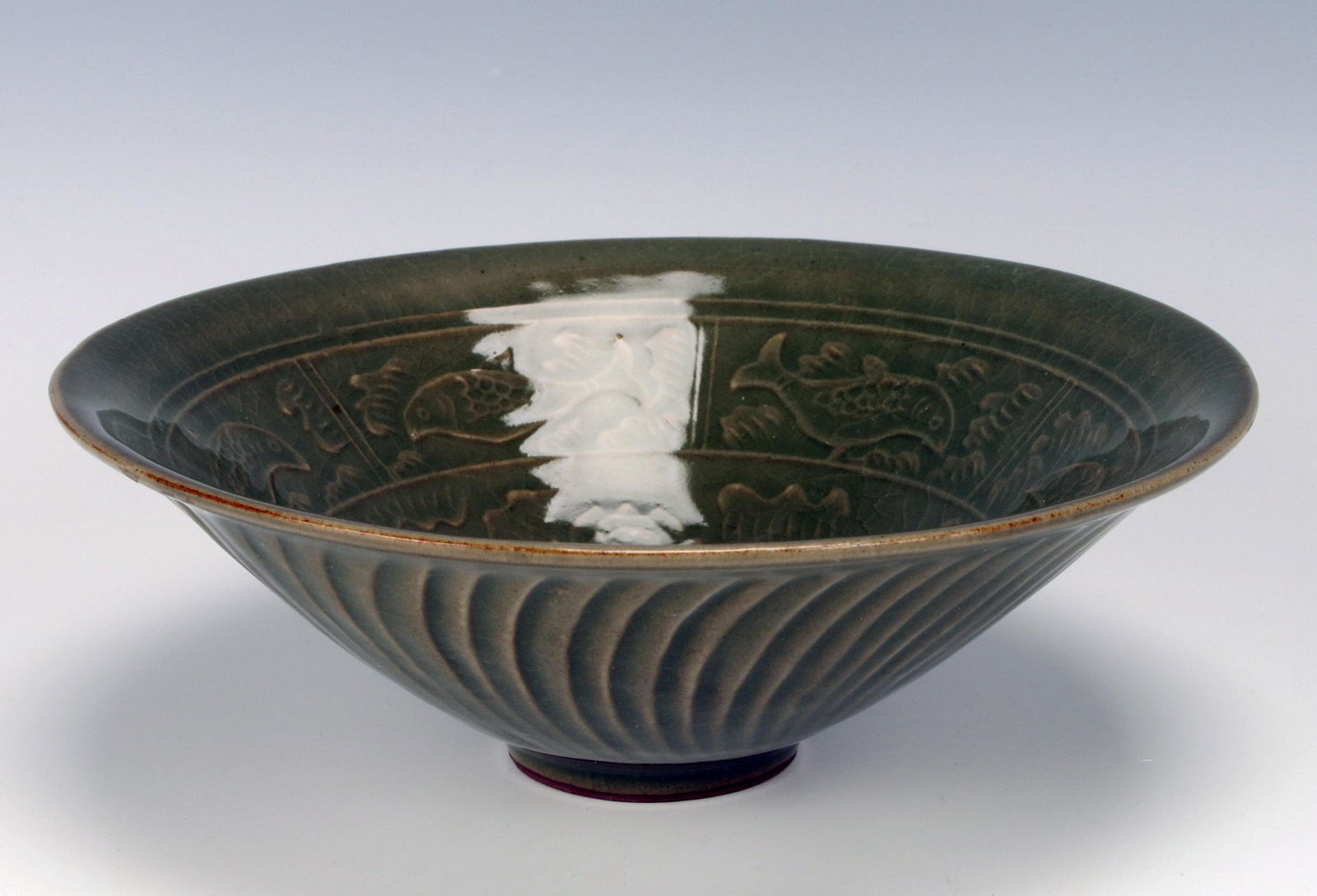 DARK CELADON FISH BOWL: DARK CELADON FISH BOWL Stunning dark celadon bowl with swimming fish and lotus design in center, all over crackle finish. 7 1/2" X 2 3/4"