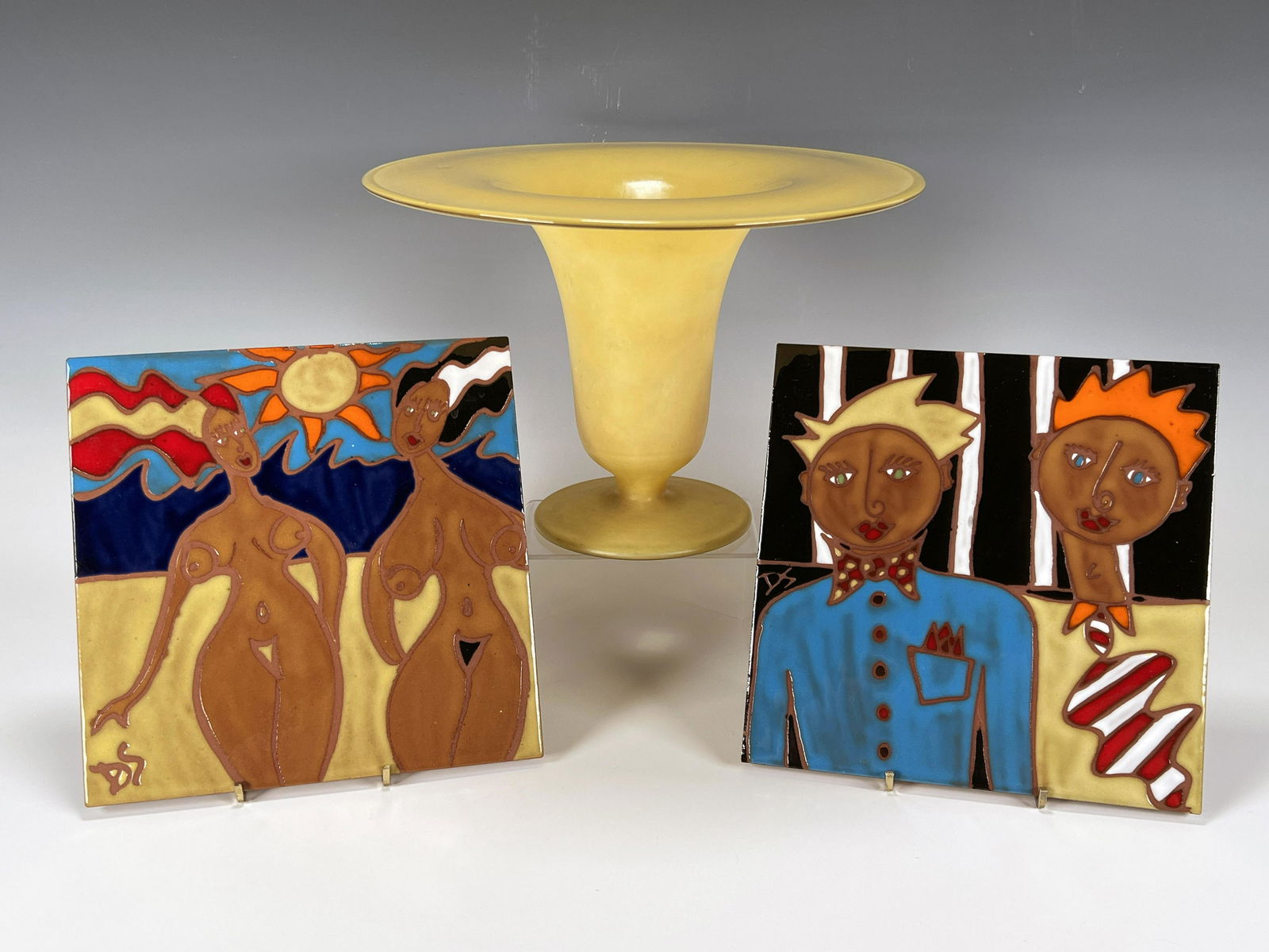 VASE & TWO HAND PAINTED SORRENTINO TILES: VASE & TWO HAND PAINTED SORRENTINO TILES Yellow glass vase with wide rim. Two stylized tiles 'Oh That Nude Beach' dated 6/95 and 'Buddies' 4/95 signed D. Sorrentino.