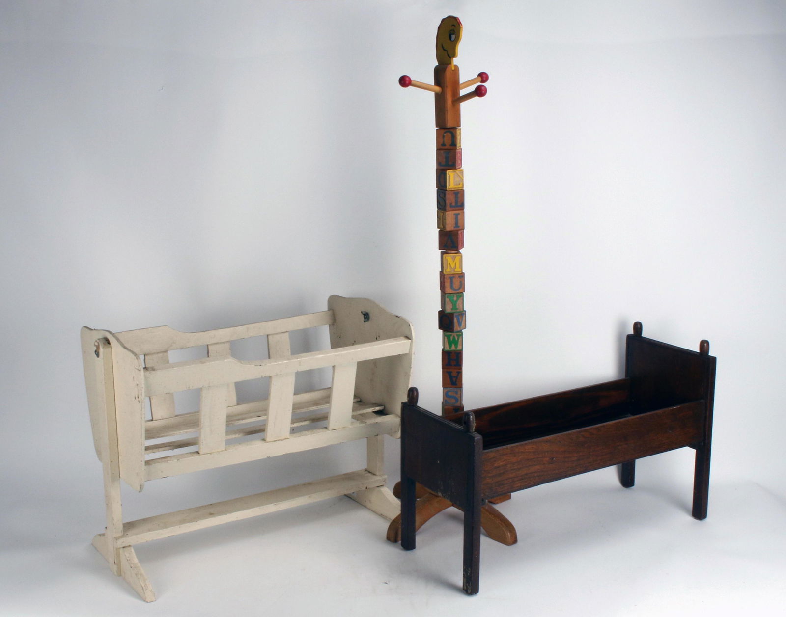 ANTIQUE WOODEN DOLL CRADLES & CHILDS COAT RACK: ANTIQUE WOODEN DOLL CRADLES & CHILDS COAT RACK Handmade rocking cradle and doll bed. Coat tree rack made from stacked wooden blocks. Converse Auctions does not recommend using t